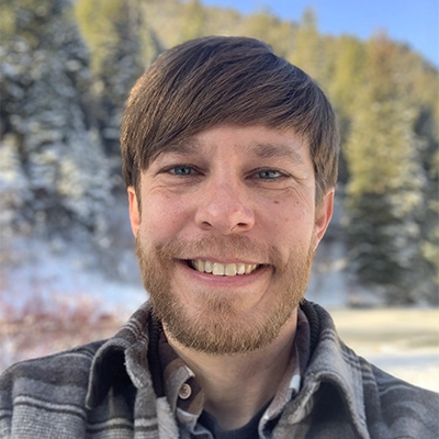 Justin Beagley smiling outside.